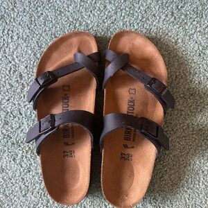 Birkenstock Black Sandals with Adjustable Straps and Contoured Footbed